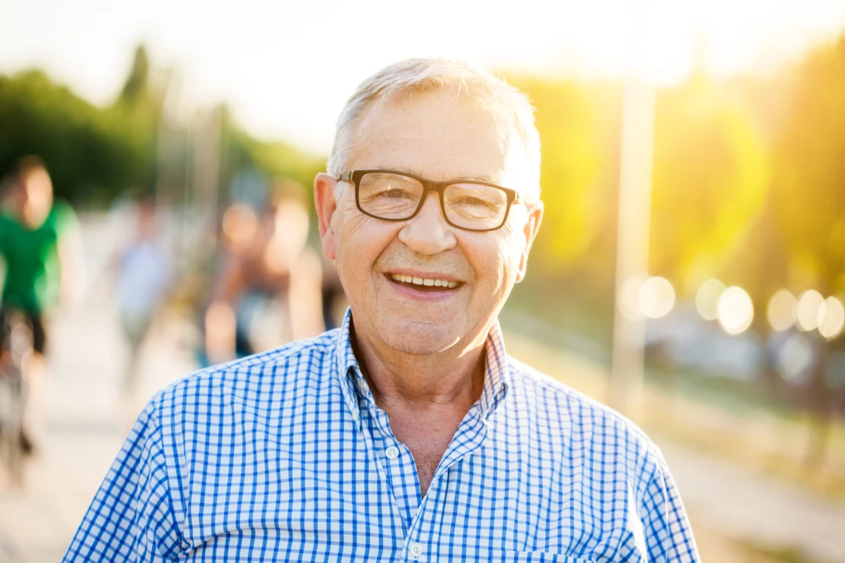 A smiling older man outdoors