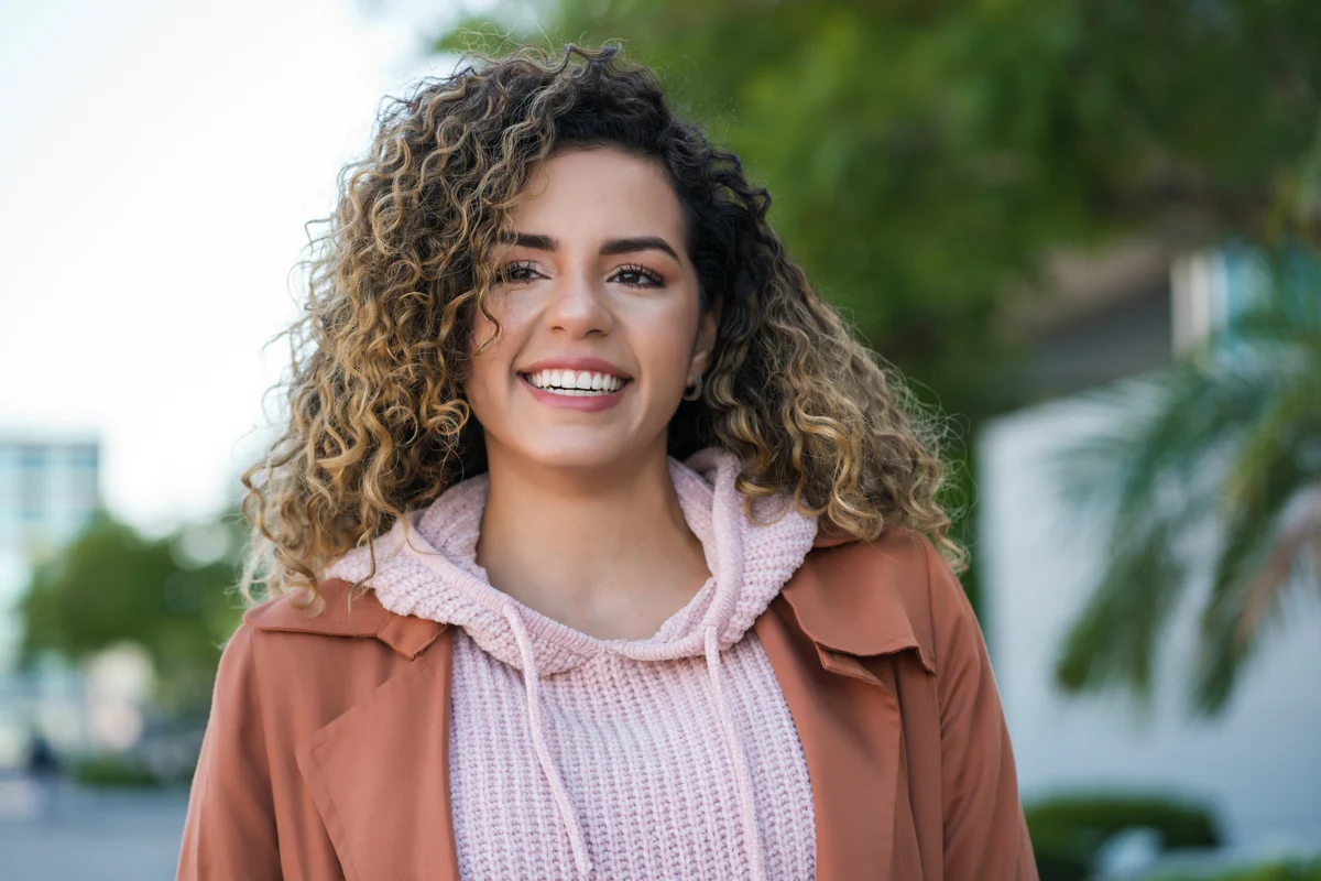 A smiling woman outdoors